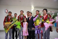 Lễ đón xạ thủ Hoàng Xuân Vinh tại sân bay Nội Bài. (Ảnh: Minh Sơn/Vietnam+)
