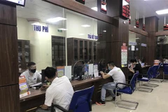 Người dân đến làm thủ tục hành chính tại Trung tâm phục vụ hành chính công tỉnh Yên Bái, trong Quý I năm 2020. (Ảnh: Việt Dũng/TTXVN)