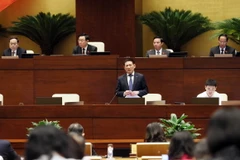 Bộ trưởng Bộ Tài chính Hồ Đức Phớc trả lời chất vấn của đại biểu Quốc hội. (Ảnh: An Đăng/TTXVN)