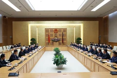 Thủ tướng Phạm Minh Chính tiếp Chủ tịch Chính hiệp Trung Quốc Vương Hộ Ninh. (Ảnh: Dương Giang/TTXVN)