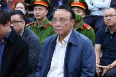 Bị cáo Đỗ Anh Dũng (sinh năm 1961, Chủ tịch Hội đồng quản trị kiêm Tổng Giám đốc Công ty Tân Hoàng Minh) tại phiên tòa ngày 22/3. (Ảnh: Phạm Kiên/TTXVN)