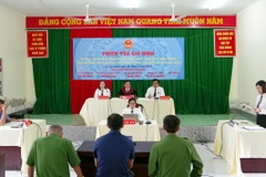 Phiên tòa giả định tuyên truyền về chống khai thác thủy sản IUU. (Ảnh: TTXVN phát)