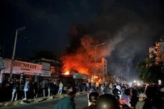 Hiện trường vụ cháy nhà sách Tuấn Minh. (Ảnh: TTXVN phát)