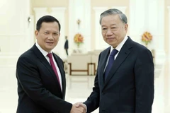 Chủ tịch nước Tô Lâm với Thủ tướng Campuchia Hun Manet. (Ảnh: Nhan Sáng/TTXVN)