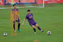 Các cầu thủ U23 Việt Nam tích cực tập luyện. (Ảnh: Minh Quyết/TTXVN)