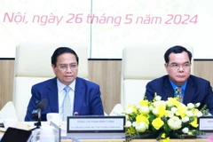 Thủ tướng Phạm Minh Chính phát biểu tại Hội nghị đánh giá việc thực hiện quy chế về mối quan hệ công tác giữa Chính phủ với Tổng Liên đoàn Lao động Việt Nam. (Ảnh: Dương Giang/TTXVN)