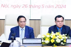Thủ tướng Phạm Minh Chính phát biểu tại Hội nghị đánh giá việc thực hiện quy chế về mối quan hệ công tác giữa Chính phủ với Tổng Liên đoàn Lao động Việt Nam. (Ảnh: Dương Giang/TTXVN)