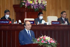 Chủ tịch nước Nguyễn Xuân Phúc phát biểu tại Kỳ họp lần thứ nhất, Quốc hội Lào khóa IX. (Ảnh: Thống Nhất/TTXVN)