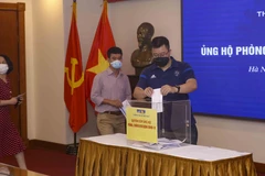 [Photo] TTXVN quyên góp ủng hộ phòng, chống dịch COVID-19