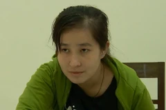 Đối tượng Lâm thị Tố Quyên tại cơ quan công an. (Ảnh: TTXVN phát)