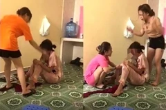 Nhóm đối tượng hành hung dã man V.T.H.T, quay clip đăng lên mạng xã hội. Ảnh cắt từ clip. (Nguồn: laodong.vn)