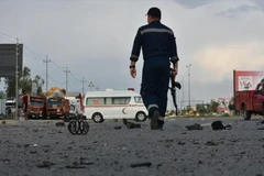 Hiện trường một vụ tấn công tại Baghdad, Iraq. (Ảnh: Anadolu Agency/TTXVN)