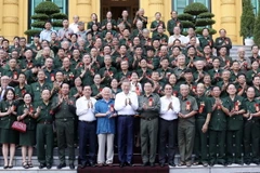 Chủ tịch nước Tô Lâm gặp mặt thân mật các đại biểu. (Ảnh: Nhan Sáng/TTXVN)