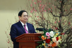 Thủ tướng Phạm Minh Chính chúc Tết ngành ngân hàng. (Ảnh: Dương Giang/TTXVN)