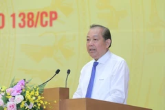 Phó Thủ tướng Thường trực Chính phủ Trương Hòa Bình, Trưởng Ban Chỉ đạo 138 Chính phủ (138/CP) về phòng, chống tội phạm và Ban Chỉ đạo 389 quốc gia về chống buôn lậu, gian lận thương mại và hàng giả phát biểu khai mạc Hội nghị. (Ảnh: Doãn Tấn/TTXVN)