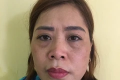 Đối tượng Nguyễn Thị Hồng tại cơ quan công an. (Nguồn: TTXVN)