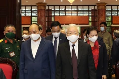 Tổng Bí thư, Chủ tịch nước Nguyễn Phú Trọng, Thủ tướng Chính phủ Nguyễn Xuân Phúc, Chủ tịch Quốc hội Nguyễn Thị Kim Ngân đến dự Hội nghị. (Ảnh: Trí Dũng/TTXVN) 