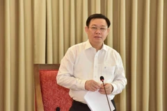 Bí thư Thành ủy Hà Nội Vương Đình Huệ chủ trì hội nghị. (Nguồn: TTXVN)