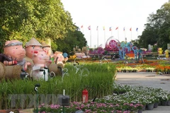 Những chú lợn đất ngộ nghĩnh đón chào Năm mới trên Đường hoa Tết Kỷ Hợi 2019. (Ảnh: Thanh Vũ/TTXVN)