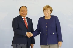 Thủ tướng Đức Angela Merkel và Thủ tướng Nguyễn Xuân Phúc. (Ảnh: Thống Nhất/TTXVN)