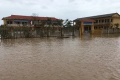 Nhiều xã ở huyện Quảng Điền bị ngập lụt sâu, trên diện rộng. (Ảnh: Đỗ Trưởng/TTXVN)