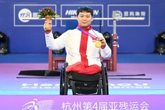 Đô cử Qi Yongkai của Trung Quốc giành Huy chương vàng ở hạng cân 59 kg nam tại Đại hội Thể thao Người khuyết tật châu Á lần thứ 4 ở Hàng Châu, Trung Quốc, ngày 24/10/2023. (Ảnh: THX/TTXVN)