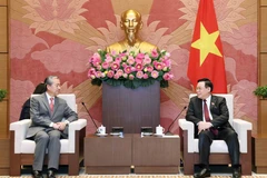 Chủ tịch Quốc hội Vương Đình Huệ tiếp Đại sứ Trung Quốc tại Việt Nam Hùng Ba. (Ảnh: Nhan Sáng/TTXVN)