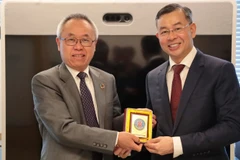 Tổng Kiểm toán Nhà nước Việt Nam Ngô Văn Tuấn gặp Phó Tổng Thư ký Liên hợp quốc phụ trách các vấn đề kinh tế và xã hội Li Junhua. (Ảnh: Thanh Tuấn/TTXVN)