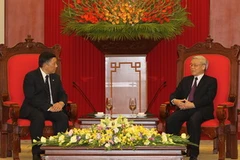 Tổng Bí thư Nguyễn Phú Trọng tiếp Ngài Khoo Boon Hui. (Ảnh: Trí Dũng/TTXVN)