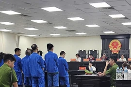 Phiên tòa xét xử 9 bị cáo trong vụ bắt giữ người, đòi nợ hộ. (Nguồn: Báo Lao động)