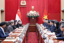 Đại tướng Lương Tam Quang, Bộ trưởng Bộ Công an hội đàm với Bộ trưởng Bộ Phát triển Kỹ thuật số và Thông tin Singapore Josephine Teo. (Ảnh: Phạm Kiên/TTXVN)