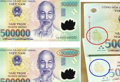 Tiền thật và tiền giả mệnh giá 500.000 đồng. (Nguồn: Công an Kiên Giang)