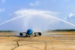 Chuyến bay đầu tiên của Vietnam Airlines khai trương Nhà ga T3 Tân Sơn Nhất đi vào hoạt động. (Ảnh: PV/Vietnam+)