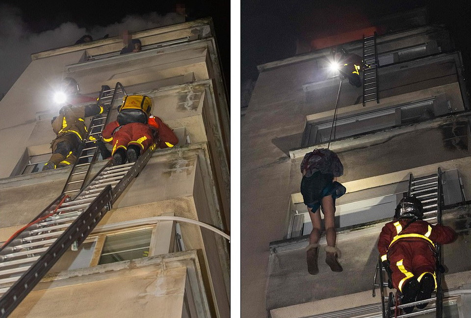 Lực lượng cứu hỏa cứu các nạn nhân ra khỏi tòa nhà.