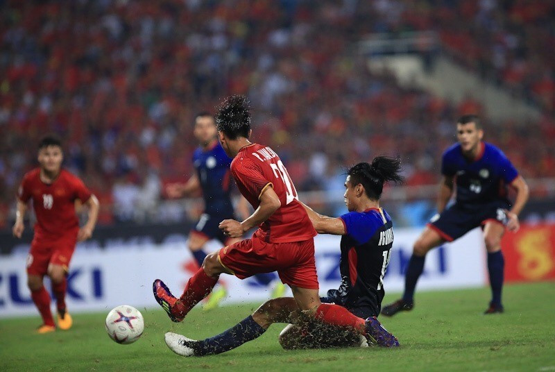 Phải đến phút 83, thế cân bằng mới được phá vỡ... (Ảnh: Trọng Đạt/TTXVN)