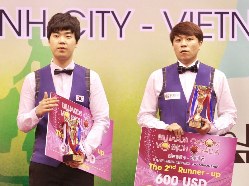 Tay cơ Kim Haeng Jik (trái, Hàn Quốc) và tay cơ Choi Sung Won (Hàn Quốc) đồng hạng ba nội dung 3 băng. (Ảnh: Quang Nhựt/TTXVN)