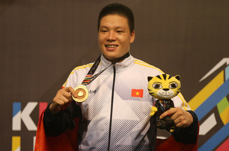 VĐV Nguyễn Văn Trí giành huy chương vàng ở nội dung đối kháng hạng cân 90kg nam. (Ảnh: Quốc Khánh/TTXVN)