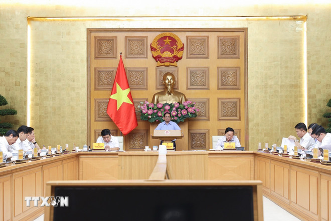 Statsminister Pham Minh Chinh avsluttet et arbeidsmøte om fjerning av hindringer i standardiseringsaktiviteter for varer. (Foto: Duong Giang/VNA) ttxvn-thu-tuong-quy-chuan-hang-hoa-3.jpg