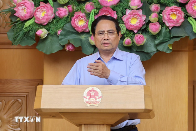 Statsminister Pham Minh Chinh avsluttet et arbeidsmøte om fjerning av hindringer i standardiseringsaktiviteter for varer. (Foto: Duong Giang/VNA) ttxvn-thu-tuong-quy-chuan-hang-hoa-2.jpg