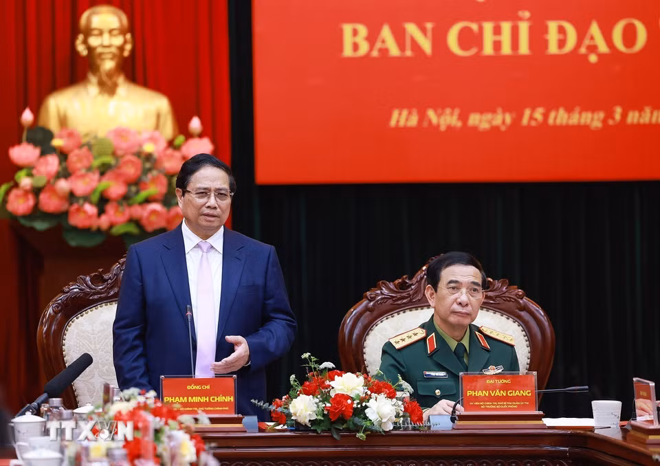 Thủ tướng Phạm Minh Chính làm việc với Bộ Quốc phòng và các bộ, ngành về công nghiệp quốc phòng công nghệ cao. (Ảnh: Dương Giang/TTXVN)