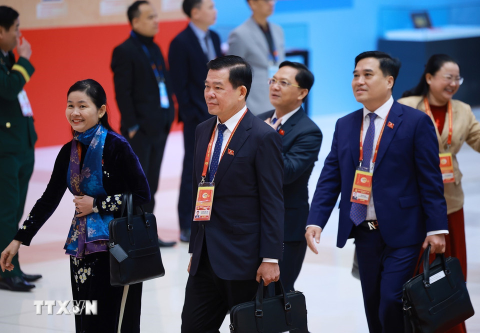 Các đại biểu đến dự ngày làm việc thứ tư Đại hội XIV của Đảng, sáng 22/1. (Ảnh: TTXVN)