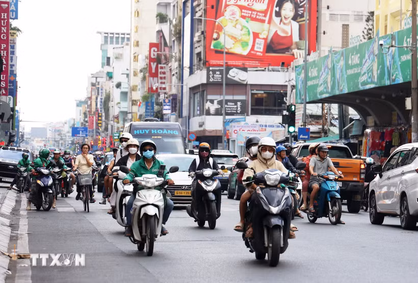Tài xế công nghệ tại thành phố Hồ Chí Minh. (Ảnh: Hồng Đạt/TTXVN)