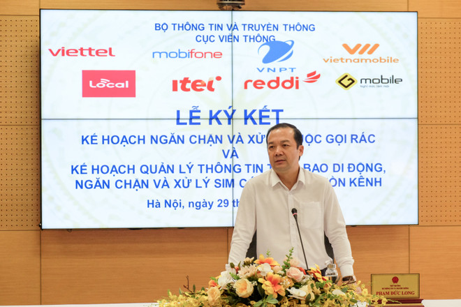 Thứ trưởng Bộ Thông tin và Truyền thông Phạm Đức Long chia sẻ tại Lễ ký kết. (Ảnh: Minh Sơn/Vietnam+) Các nhà mạng Việt Nam 'bắt tay' xử lý dứt điểm cuộc gọi rác ảnh 2