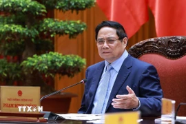 Thủ tướng Phạm Minh Chính chủ trì cuộc họp về triển khai đẩy nhanh tiến độ thực hiện các dự án đường sắt kết nối Việt-Trung. (Ảnh: Dương Giang/TTXVN)