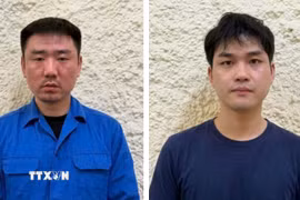 Đối tượng Zhang Chengrong và Nie Changao (từ trái qua phải). (Ảnh: TTXVN phát)