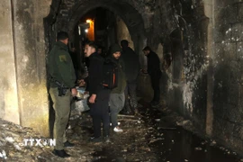 Hiện trường một vụ đánh bom ở thành phố Aleppo ngày 1/1. (Ảnh: THX/TTXVN)