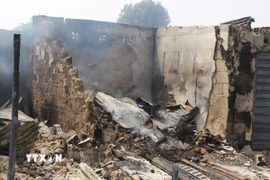 Hiện trường một vụ tấn công tại Auno, Nigeria. (Ảnh: AFP/TTXVN)