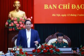 Thủ tướng Phạm Minh Chính làm việc với Bộ Quốc phòng và các bộ, ngành về kết quả hoạt động nghiên cứu, sản xuất, phát triển công nghiệp quốc phòng. (Ảnh: Dương Giang/TTXVN)