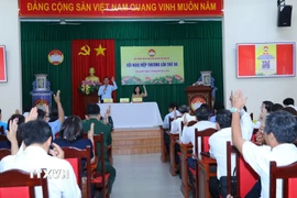 Các đại biểu tỉnh Đồng Nai dự hội nghị biểu quyết thống nhất danh sách chính thức những người ứng cử Đại biểu Quốc hội khóa XVI. (Ảnh: Lê Xuân/TTXVN)