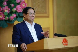 Thủ tướng Phạm Minh Chính họp đẩy nhanh tiến độ triển khai xây dựng lại, sửa chữa nhà ở cho các gia đình bị thiệt hại do các đợt thiên tai tại miền Trung. (Ảnh: Dương Giang/TTXVN)